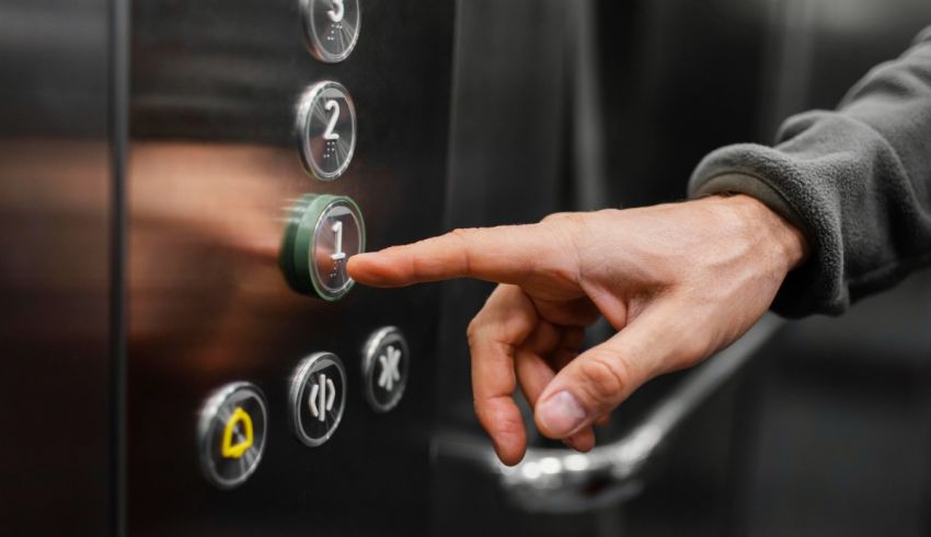 A person pressing a button on an elevator.