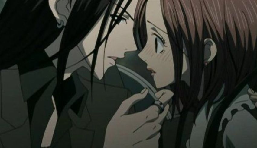 A girl with long hair is kissing another girl with long hair.