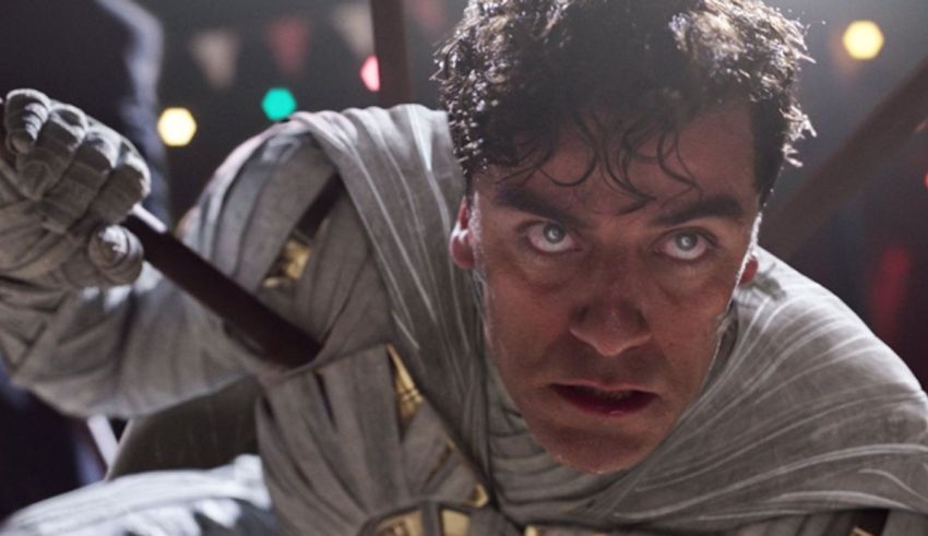 A man in a white costume holding a sword.