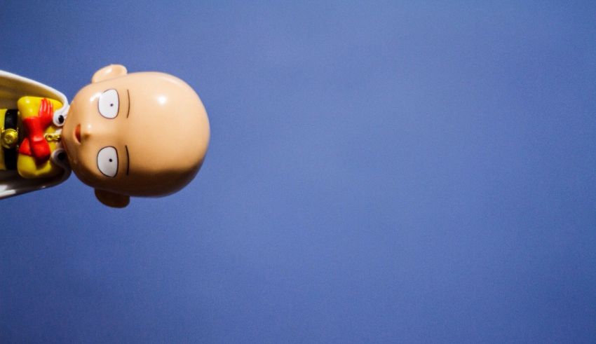 A toy of a man with a hat on his head.