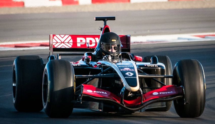 A person driving a racing car on a track.