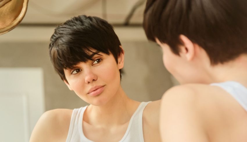 A woman looking at herself in the mirror.