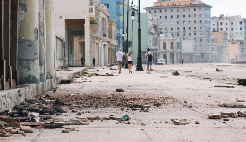 People walking down a street in havana.