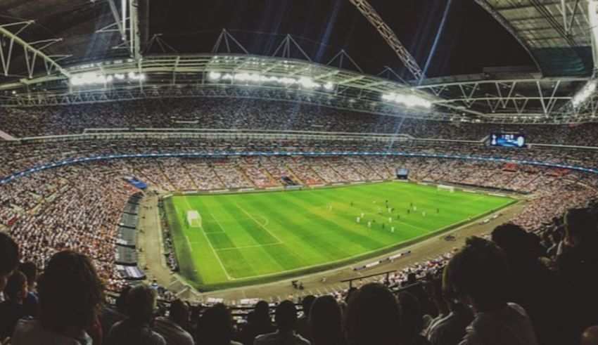 A stadium full of people watching a soccer match.