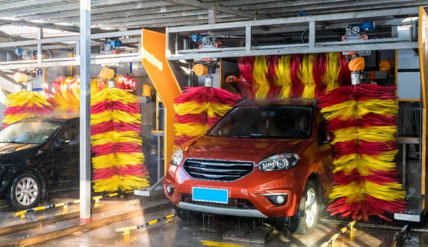 A car is being washed in a car wash.
