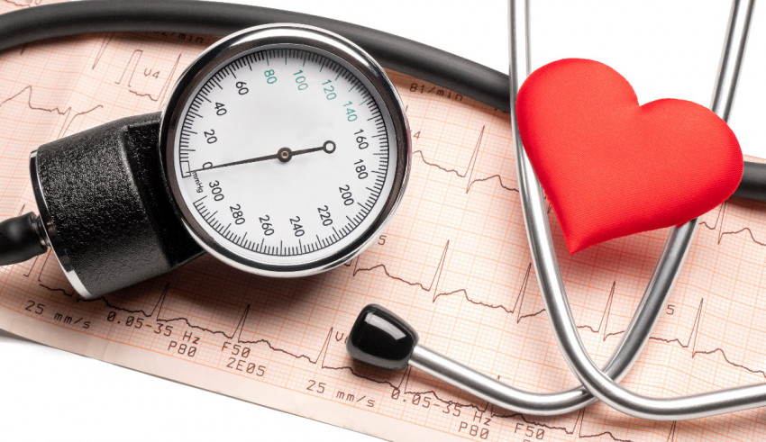 A stethoscope with a red heart on top of it.