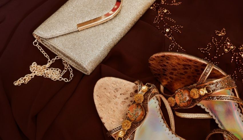 A pair of sandals and a purse on a brown background.