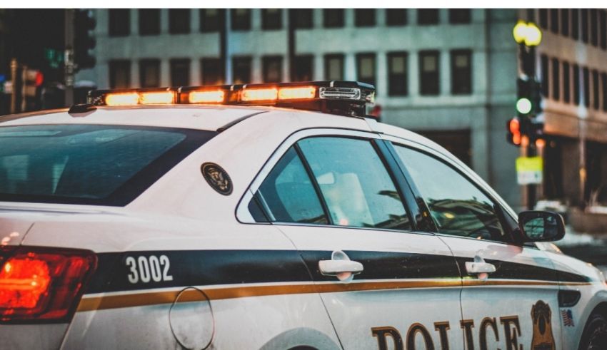 A police car is parked on a city street.