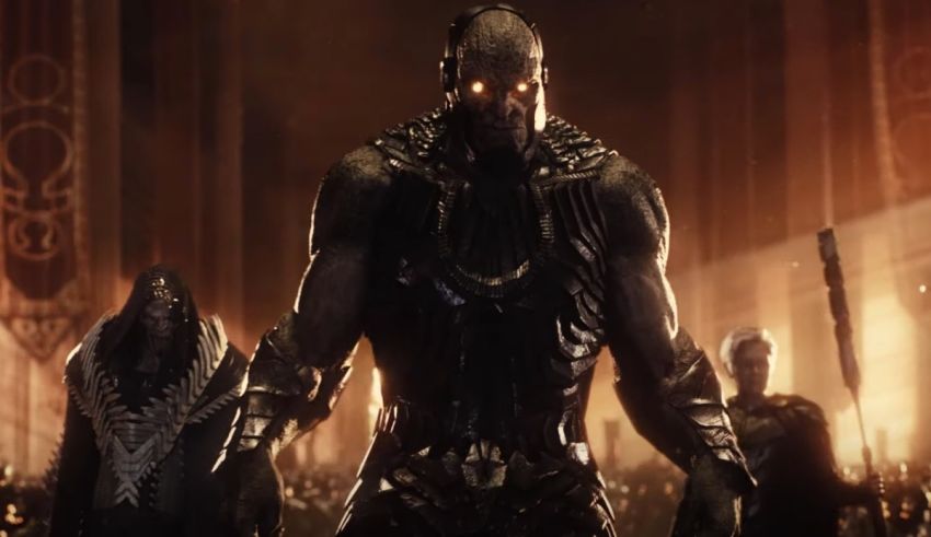 A group of men in armor standing in front of a group of people.