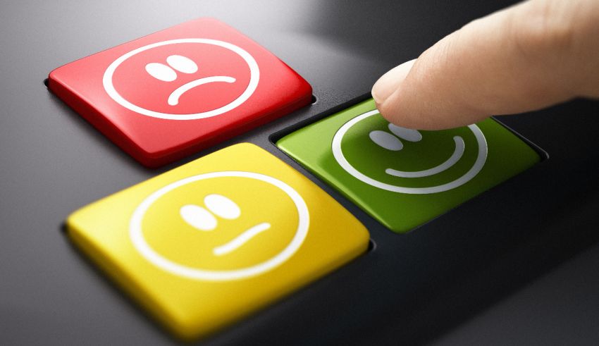 A person is pressing buttons with smiley faces on them.