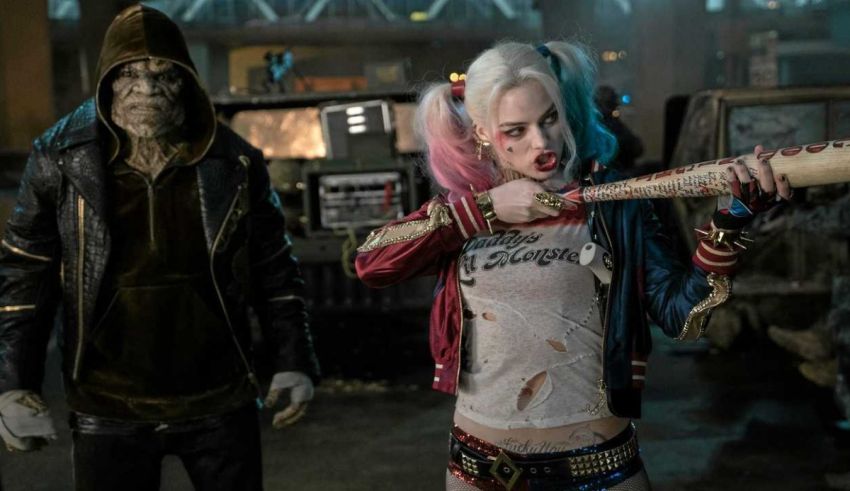 Harley quinn and the joker holding a bat.