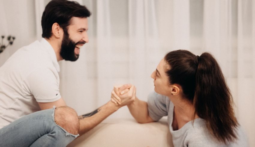 A man and woman are sitting on a couch together.
