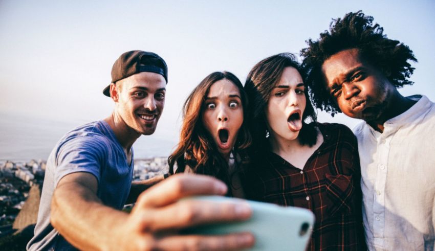 A group of people taking a selfie.