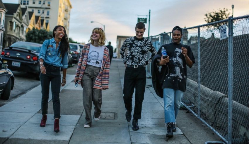 A group of people walking down a street in san francisco.