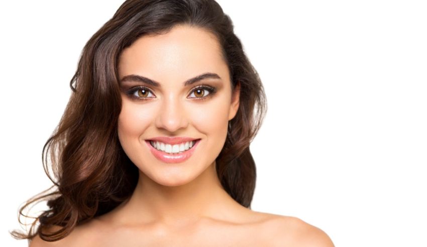 A beautiful woman smiling for the camera.