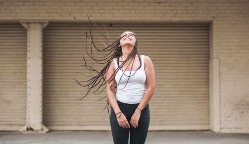 A young woman with her hair blowing in the wind.