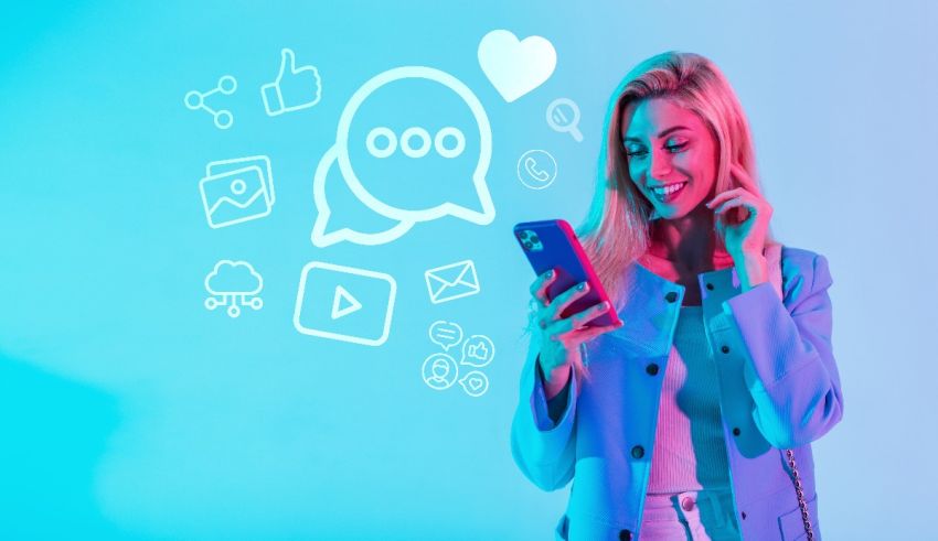 A woman holding a cell phone with social media icons on it.