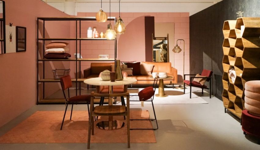 A living room with pink walls and furniture.