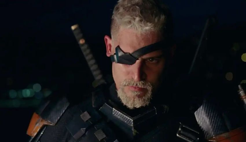 A man in a suit with a sword in his hand.