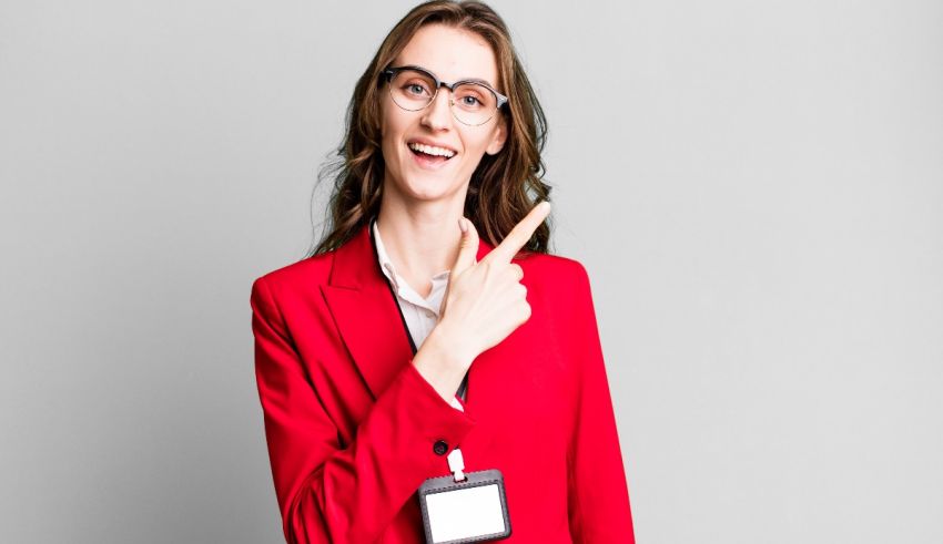 A woman in a red suit pointing to her finger.