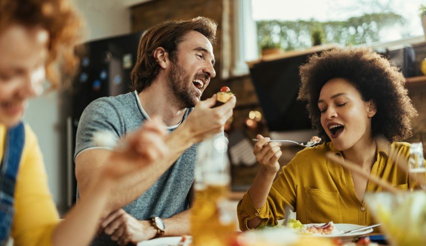 A group of people eating together at a table.