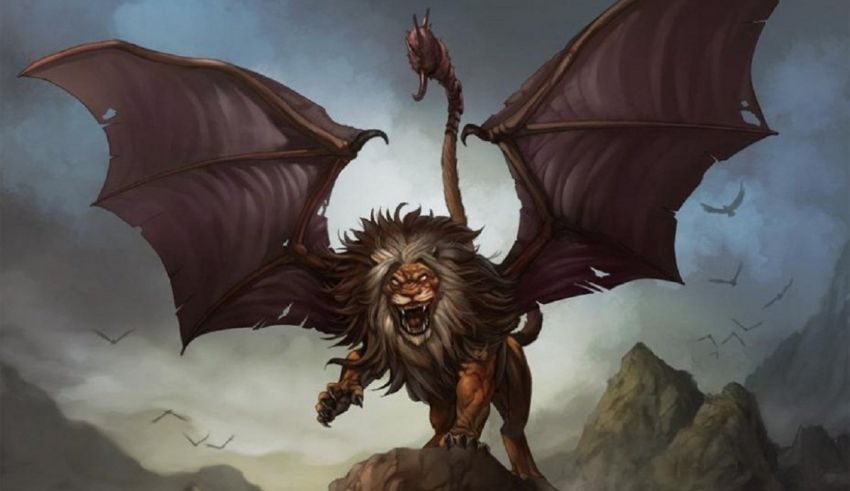 A lion with wings on top of a mountain.