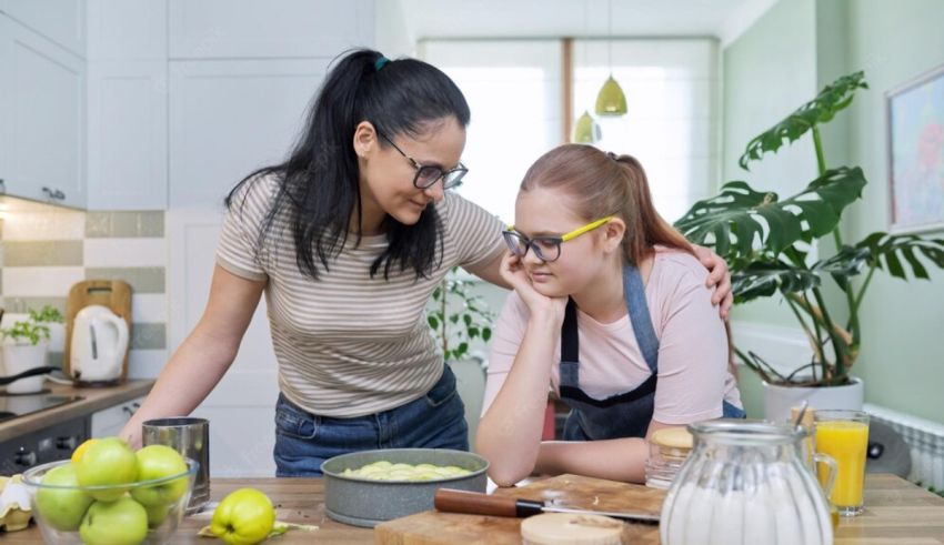Two women are preparing food in the kitchen.