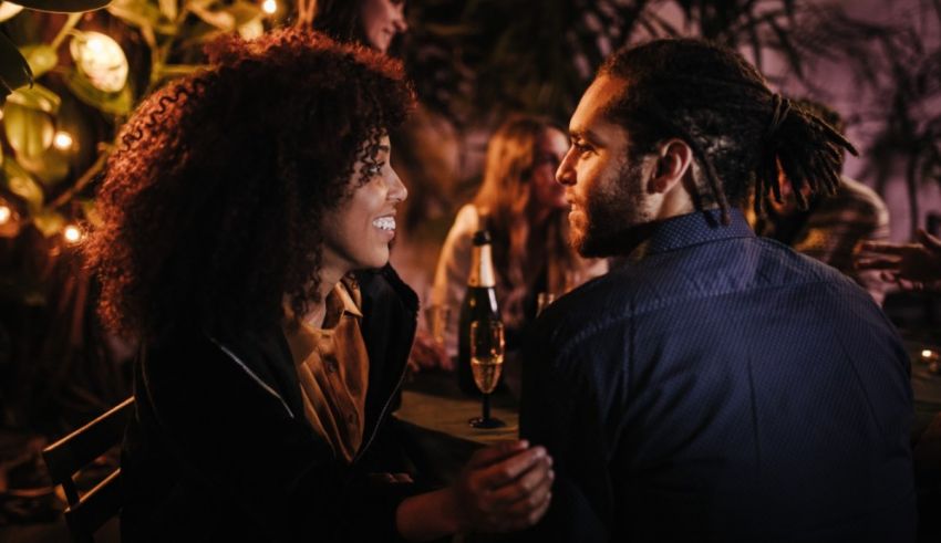 A man and woman are having a romantic dinner at a restaurant.