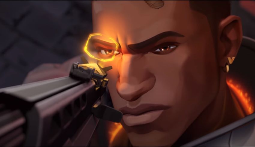 A man with a gun in front of him.