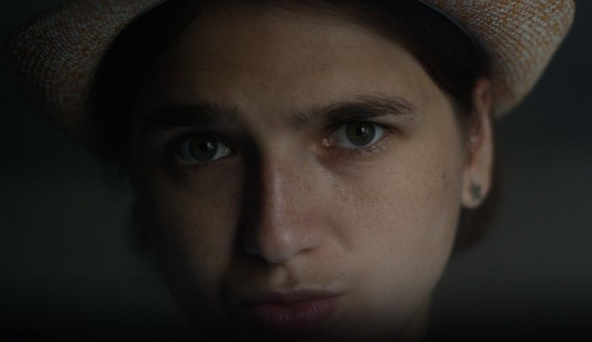 A young woman wearing a hat.