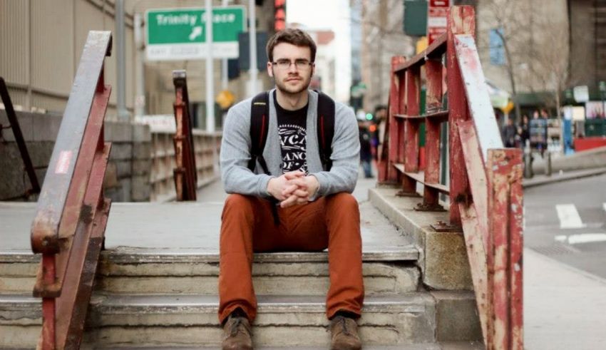 A man sitting on stairs.