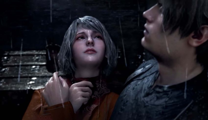 A man and a woman standing in the rain.