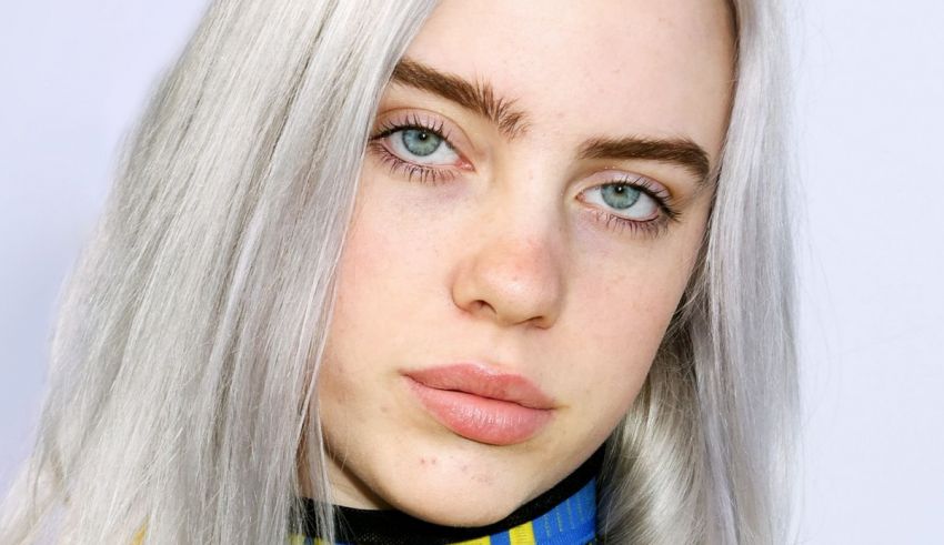 A young woman with white hair and a blue collar.