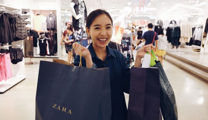 A woman holding shopping bags.