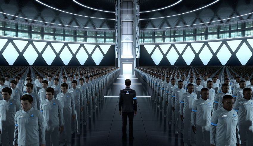 A group of people standing in a large room.