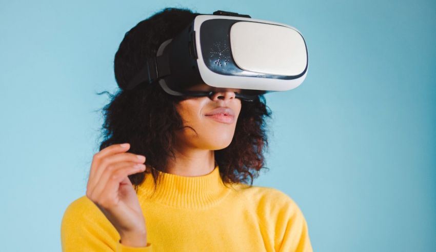 A woman wearing a virtual reality headset on a blue background.