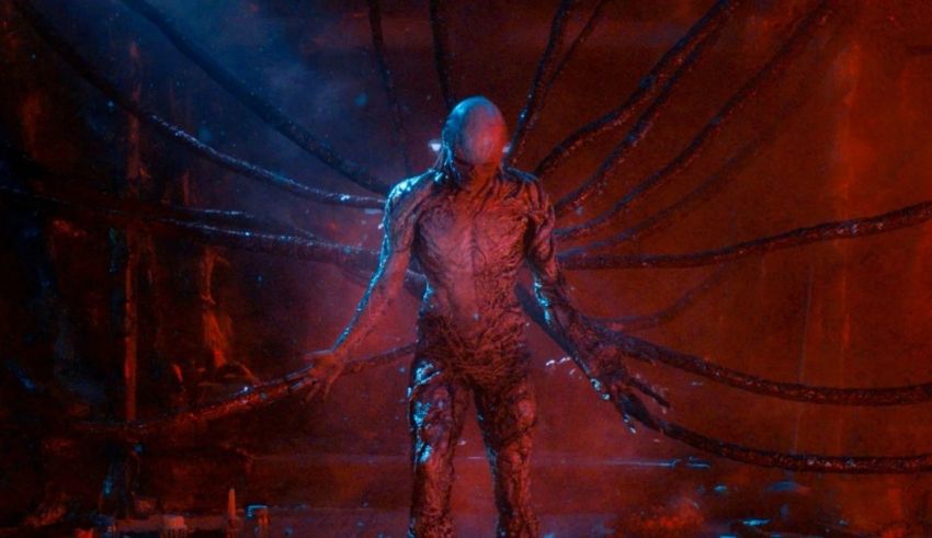 A creature with tentacles standing in a dark room.