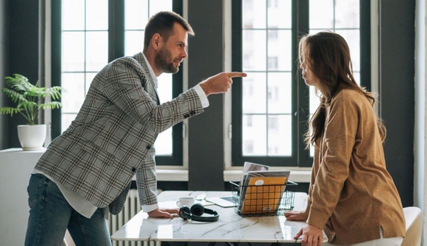 A man and a woman arguing in an office.