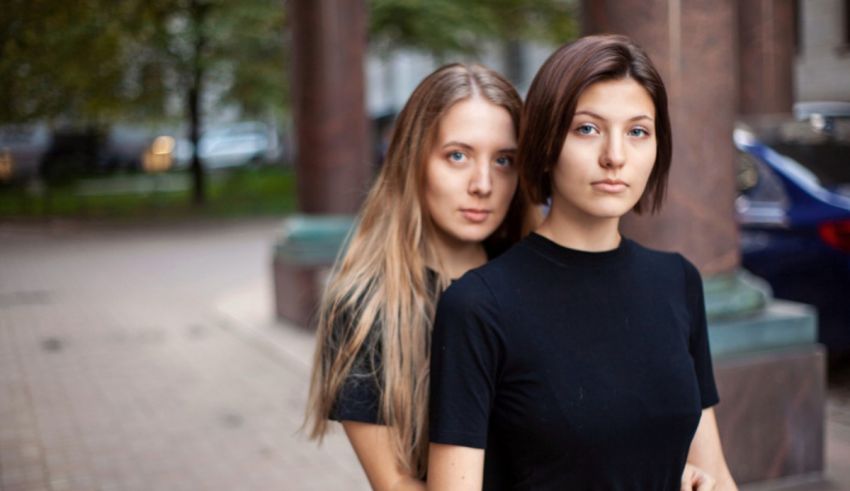 Two young women standing next to each other.