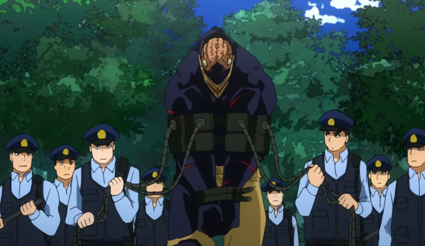 A group of police officers standing in a forest.